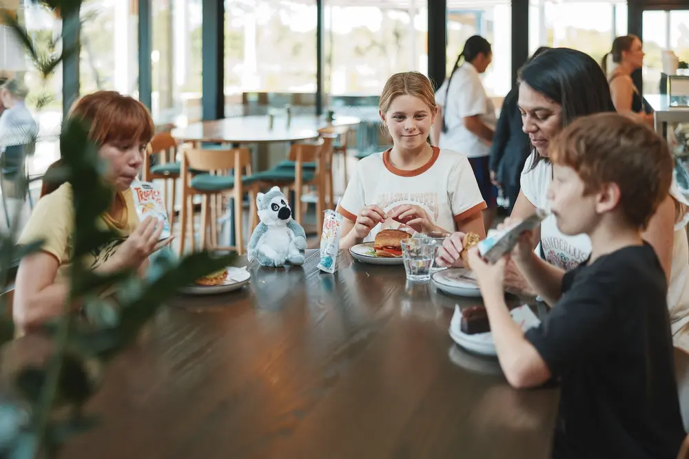 A family enjoying a meal at the cafe at Hamilton Zoo