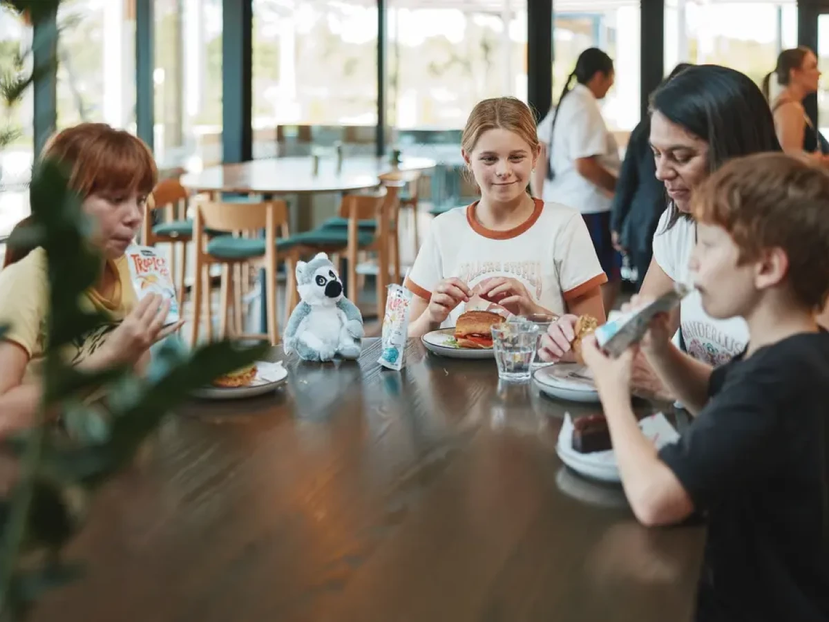 A family enjoying a meal at the cafe at Hamilton Zoo